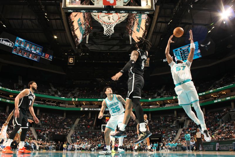 CHARLOTTE, NC - JANUARY 29:  Taj Gibson #67 of the Charlotte Hornets grabs the rebound during the game against the Brooklyn Nets on January 29, 2025 at Spectrum Center in Charlotte, North Carolina. NOTE TO USER: User expressly acknowledges and agrees that, by downloading and or using this photograph, User is consenting to the terms and conditions of the Getty Images License Agreement. Mandatory Copyright Notice: Copyright 2025 NBAE (Photo by Kent Smith/NBAE via Getty Images)