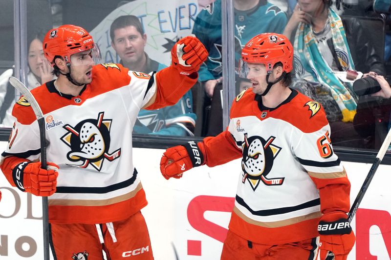 Oct 11, 2025; San Jose, California, USA; Anaheim Ducks left wing Cutter Gauthier (left) celebrates with defenseman Jacob Trouba (right) after scoring a goal against the San Jose Sharks during the third period at SAP Center at San Jose. Mandatory Credit: Darren Yamashita-Imagn Images