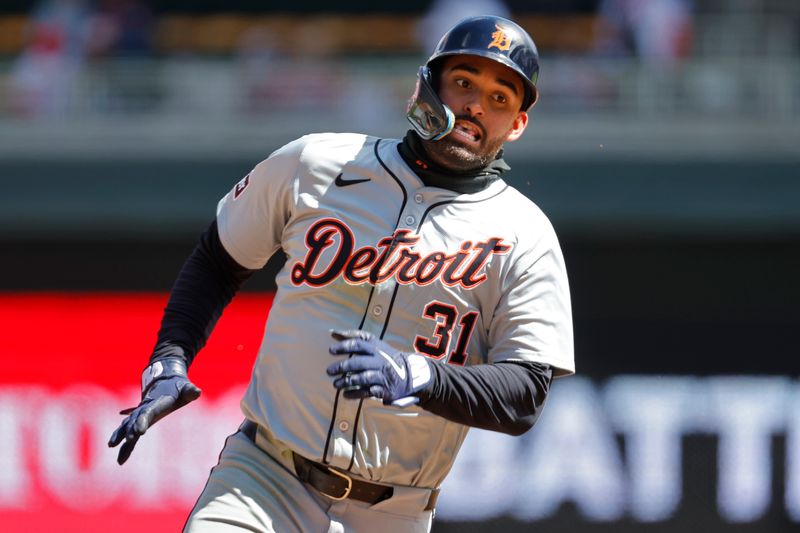 Apr 20, 2024; Minneapolis, Minnesota, USA; Detroit Tigers left fielder Riley Greene (31) rounds third base en route to scoring against the Minnesota Twins in the sixth inning at Target Field. Mandatory Credit: Bruce Kluckhohn-USA TODAY Sports