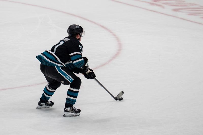 Dec 16, 2025; San Jose, California, USA; San Jose Sharks center Macklin Celebrini (71) scores on the open net during the third period against the Calgary Flames at SAP Center at San Jose. Mandatory Credit: Neville E. Guard-Imagn Images