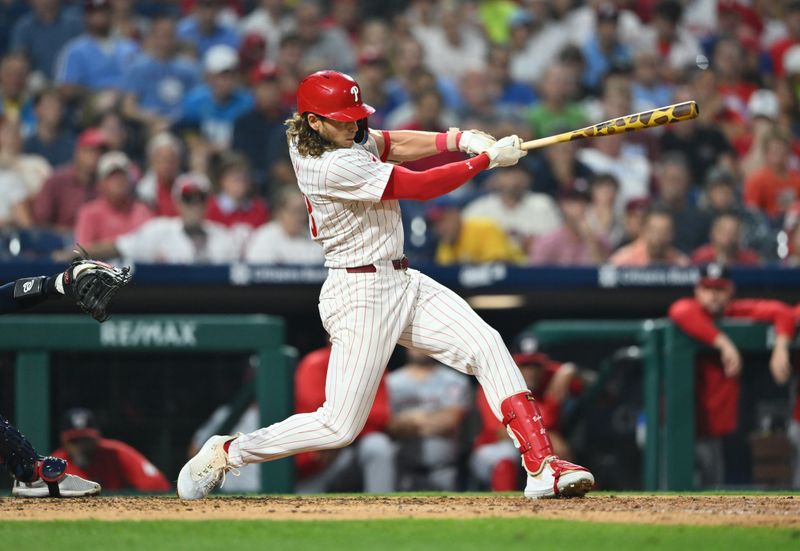 Aug 17, 2024; Philadelphia, Pennsylvania, USA; Philadelphia Phillies infielder Alec Bohm (28) hits an RBI single against the Washington Nationals in the sixth inning at Citizens Bank Park. Mandatory Credit: Kyle Ross-USA TODAY Sports