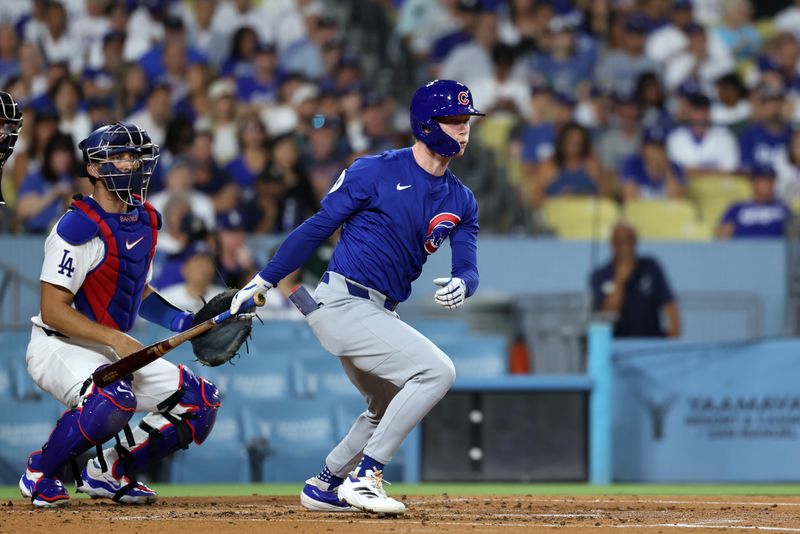 Sep 10, 2024; Los Angeles, California, USA; Chicago Cubs center fielder Pete Crow-Armstrong (52) hits a RBI single during the second inning against the Los Angeles Dodgers at Dodger Stadium. Mandatory Credit: Kiyoshi Mio-Imagn Images