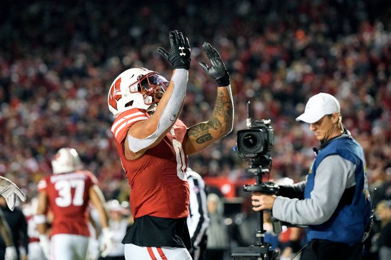 Nov 18, 2023; Madison, Wisconsin, USA;  Wisconsin Badgers running back Braelon Allen (0) celebrates after scoring a touchdown during overtime against the Nebraska Cornhuskers at Camp Randall Stadium. Mandatory Credit: Jeff Hanisch-USA TODAY Sports