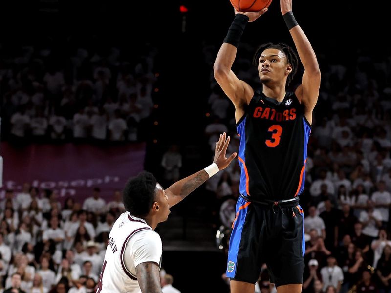 Jan 18, 2023; College Station, Texas, USA; Florida Gators forward Alex Fudge (3) takes a three-point shot while Texas A&M Aggies guard Wade Taylor IV (4) defends during the first half at Reed Arena. Mandatory Credit: Erik Williams-USA TODAY Sports
