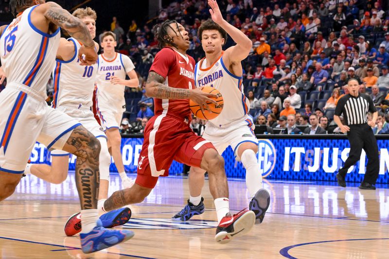 Mar 15, 2025; Nashville, TN, USA;  Alabama Crimson Tide guard Labaron Philon (0) drives to the basket against the Florida Gators during the second half at Bridgestone Arena. Mandatory Credit: Steve Roberts-Imagn Images
