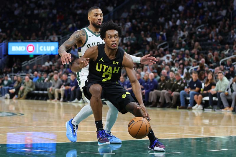 MILWAUKEE, WISCONSIN - NOVEMBER 07: Collin Sexton #2 of the Utah Jazz is defended by Damian Lillard #0 of the Milwaukee Bucks during the second half of a game at Fiserv Forum on November 07, 2024 in Milwaukee, Wisconsin.  NOTE TO USER: User expressly acknowledges and agrees that, by downloading and or using this photograph, User is consenting to the terms and conditions of the Getty Images License Agreement. (Photo by Stacy Revere/Getty Images)