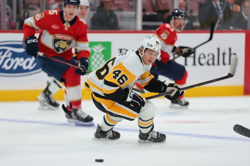 Oct 23, 2025; Sunrise, Florida, USA; Pittsburgh Penguins center Blake Lizotte (46) moves the puck against the Florida Panthers during the first period at Amerant Bank Arena. Mandatory Credit: Sam Navarro-Imagn Images