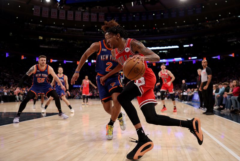 NEW YORK, NEW YORK - APRIL 14:  Dalen Terry #25 of the Chicago Bulls heads for the net as Miles McBride #2 of the New York Knicks defends during the second half at Madison Square Garden on April 14, 2024 in New York City. The New York Knicks defeated the Chicago Bulls 120-119 in OT. NOTE TO USER: User expressly acknowledges and agrees that, by downloading and or using this photograph, User is consenting to the terms and conditions of the Getty Images License Agreement. (Photo by Elsa/Getty Images)