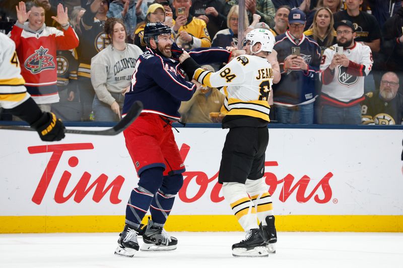Mar 29, 2026; Columbus, Ohio, USA; Columbus Blue Jackets defenseman Erik Gudbranson (44) and Boston Bruins left wing Tanner Jeannot (84) fight during the first period at Nationwide Arena. Mandatory Credit: Russell LaBounty-Imagn Images