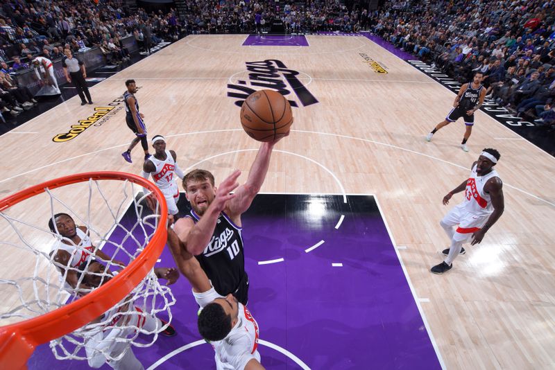 SACRAMENTO, CA - JANUARY 5: Domantas Sabonis #10 of the Sacramento Kings shoots the ball during the game against the Toronto Raptors on January 5, 2024 at Golden 1 Center in Sacramento, California. NOTE TO USER: User expressly acknowledges and agrees that, by downloading and or using this Photograph, user is consenting to the terms and conditions of the Getty Images License Agreement. Mandatory Copyright Notice: Copyright 2024 NBAE (Photo by Rocky Widner/NBAE via Getty Images)