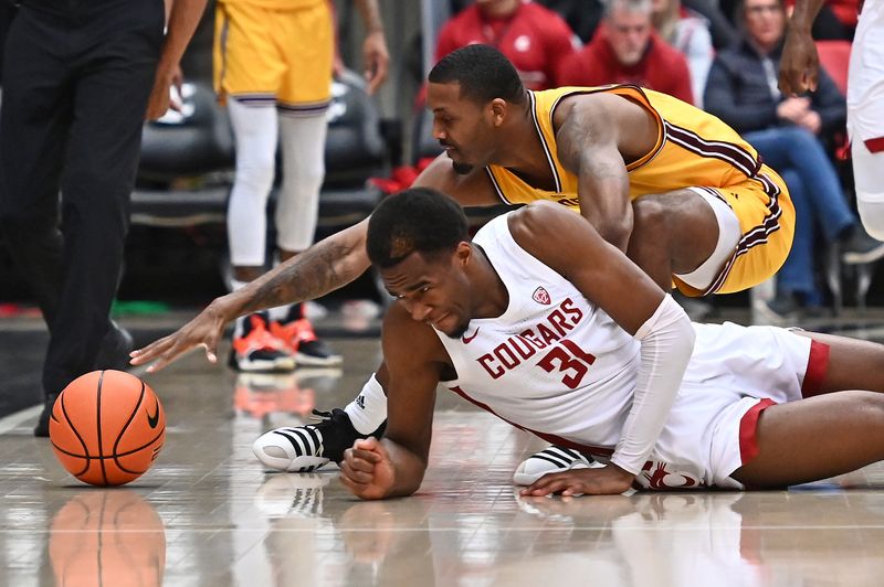 Jan 28, 2023; Pullman, Washington, USA; Arizona State Sun Devils guard Luther Muhammad (1) reaches for the ball against Washington State Cougars guard Kymany Houinsou (31) in the second half at Friel Court at Beasley Coliseum. Washington State won 75-58. Mandatory Credit: James Snook-USA TODAY Sports