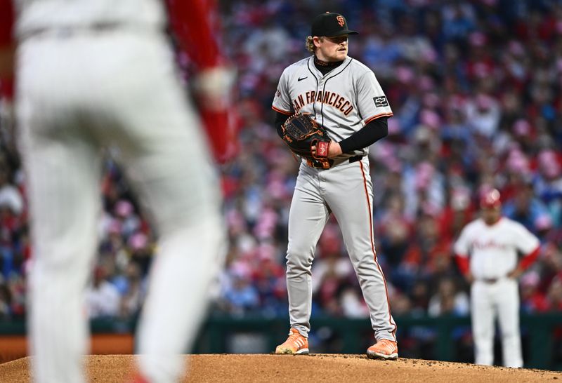 May 5, 2024; Philadelphia, Pennsylvania, USA; San Francisco Giants starting pitcher Logan Webb (62) stands on the mound with runners on base against the Philadelphia Phillies in the second inning at Citizens Bank Park. Mandatory Credit: Kyle Ross-USA TODAY Sports