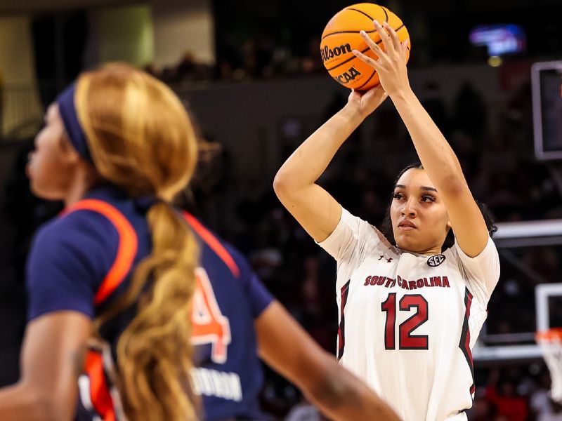 Jan 5, 2023; Columbia, South Carolina, USA; South Carolina Gamecocks guard Brea Beal (12) shoots against the Auburn Tigers in the first half at Colonial Life Arena. Mandatory Credit: Jeff Blake-USA TODAY Sports