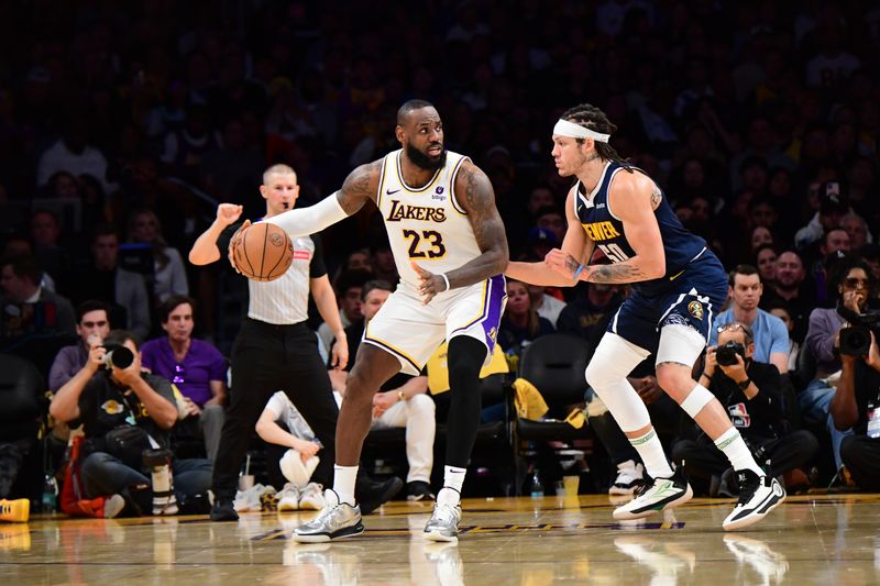 LOS ANGELES, CA - APRIL 27: LeBron James #23 of the Los Angeles Lakers /d/r against the Denver Nuggets during Round 1 Game 4 of the 2024 NBA Playoffs on April 27, 2024 at Crypto.Com Arena in Los Angeles, California. NOTE TO USER: User expressly acknowledges and agrees that, by downloading and/or using this Photograph, user is consenting to the terms and conditions of the Getty Images License Agreement. Mandatory Copyright Notice: Copyright 2024 NBAE (Photo by Adam Pantozzi/NBAE via Getty Images)