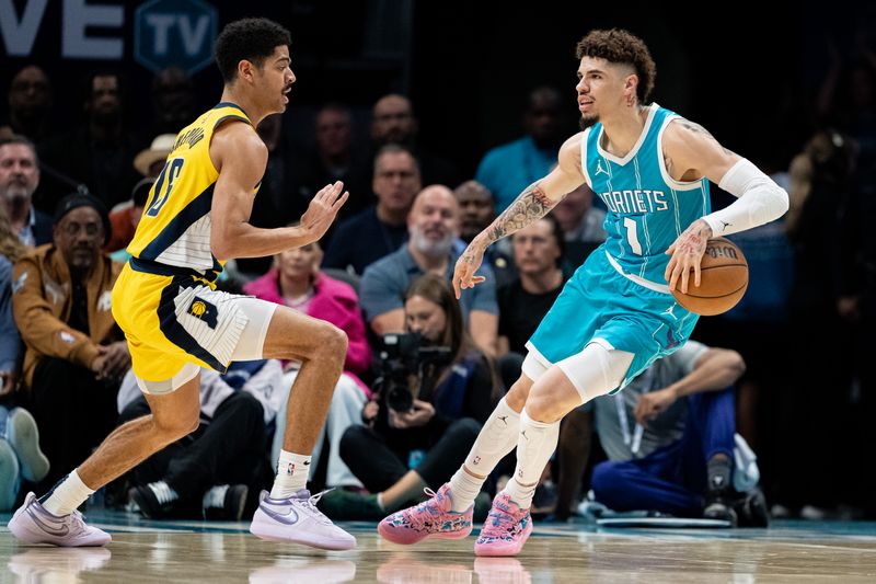 CHARLOTTE, NORTH CAROLINA - NOVEMBER 08: Ben Sheppard #26 of the Indiana Pacers guards LaMelo Ball #1 of the Charlotte Hornets in the first quarter during their game at Spectrum Center on November 08, 2024 in Charlotte, North Carolina. NOTE TO USER: User expressly acknowledges and agrees that, by downloading and or using this photograph, User is consenting to the terms and conditions of the Getty Images License Agreement. (Photo by Jacob Kupferman/Getty Images)