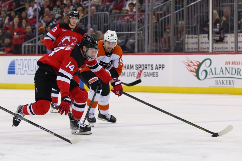 Jan 18, 2025; Newark, New Jersey, USA; New Jersey Devils right wing Nathan Bastian (14) skates with the puck while being defended by Philadelphia Flyers defenseman Rasmus Ristolainen (55) during the second period at Prudential Center. Mandatory Credit: Ed Mulholland-Imagn Images