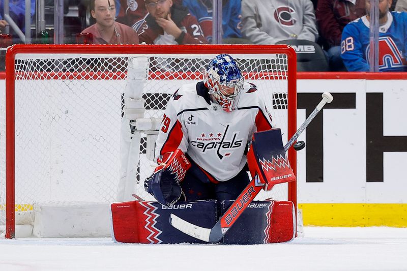 Jan 19, 2026; Denver, Colorado, USA; Washington Capitals goaltender Charlie Lindgren (79) makes a save in the third period against the Colorado Avalanche at Ball Arena. Mandatory Credit: Isaiah J. Downing-Imagn Images