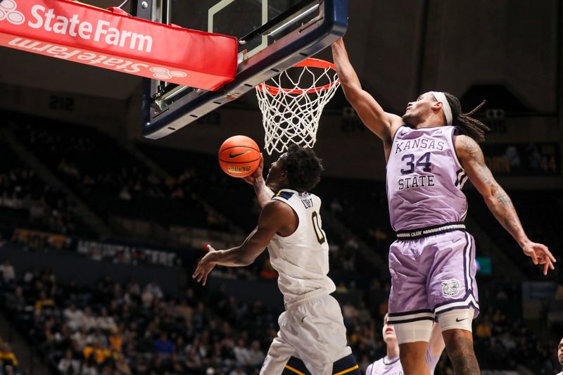 Jan 27, 2026; Morgantown, West Virginia, USA; West Virginia Mountaineers forward Brenen Lorient (0) shoots under the basket while defended by Kansas State Wildcats guard Nate Johnson (34) during the second half at Hope Coliseum. Mandatory Credit: Ben Queen-Imagn Imagesa