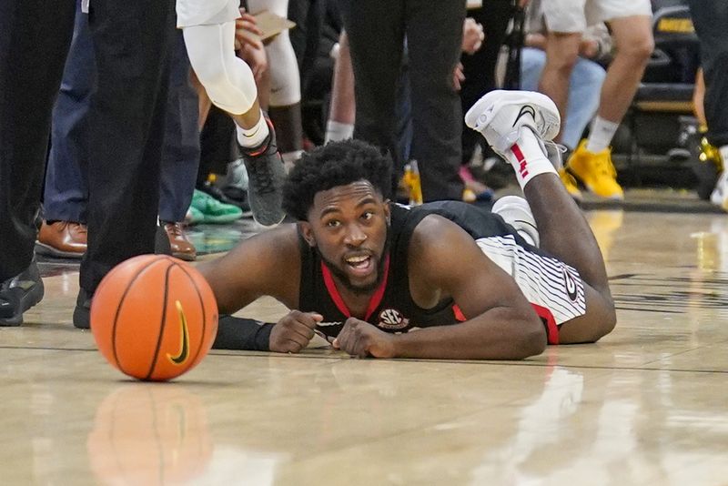 Jan 6, 2024; Columbia, Missouri, USA; Georgia Bulldogs guard Noah Thomasson (3) lays on the court against the Missouri Tigers after diving for the ball during the second half at Mizzou Arena. Mandatory Credit: Denny Medley-USA TODAY Sports