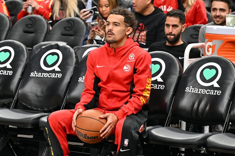 ATLANTA, GEORGIA - FEBRUARY 10: Trae Young #11 of the Atlanta Hawks warms up before the game against the Houston Rockets on February 10, 2024 at State Farm Arena in Atlanta, Georgia. NOTE TO USER: User expressly acknowledges and agrees that, by downloading and/or using this photograph, user is consenting to the terms and conditions of the Getty Images License Agreement. (Photo by Paras Griffin/Getty Images)