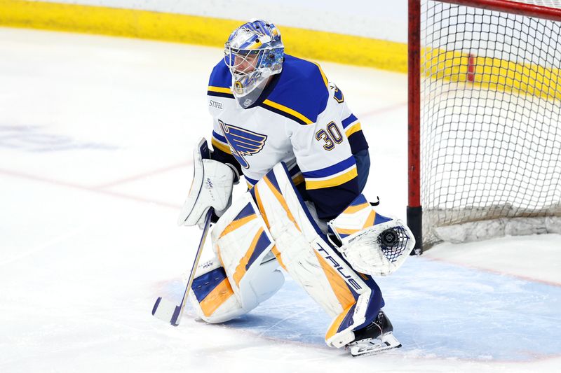 Apr 7, 2025; Winnipeg, Manitoba, CAN; St. Louis Blues goaltender Joel Hofer (30) warms up before a game against the Winnipeg Jets at Canada Life Centre. Mandatory Credit: James Carey Lauder-Imagn Images