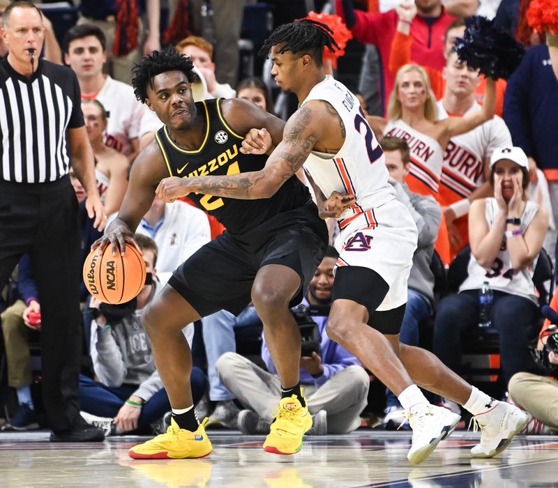 Feb 14, 2023; Auburn, Alabama, USA; Missouri Tigers guard Kobe Brown (24) is defended by Auburn Tigers guard Allen Flanigan (22) during the second half at Neville Arena. Mandatory Credit: Julie Bennett-USA TODAY Sports