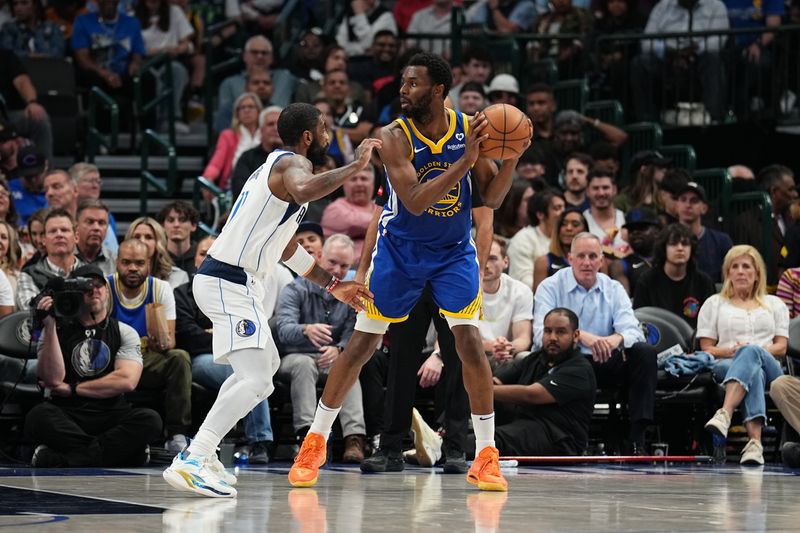 DALLAS, TX - MARCH 13: Andrew Wiggins #22 of the Golden State Warriors handles the ball during the game against the Dallas Mavericks on March 13, 2024 at the American Airlines Center in Dallas, Texas. NOTE TO USER: User expressly acknowledges and agrees that, by downloading and or using this photograph, User is consenting to the terms and conditions of the Getty Images License Agreement. Mandatory Copyright Notice: Copyright 2024 NBAE (Photo by Glenn James/NBAE via Getty Images)