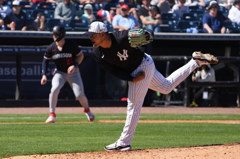Mar 6, 2025; Tampa, Florida, USA; New York Yankees pitcher Fernando Cruz (63) throws a pitch as Minnesota Twins catcher Ryan Jeffers (27) leads off third base during the fourth inning at George M. Steinbrenner Field. Mandatory Credit: Dave Nelson-Imagn Images
