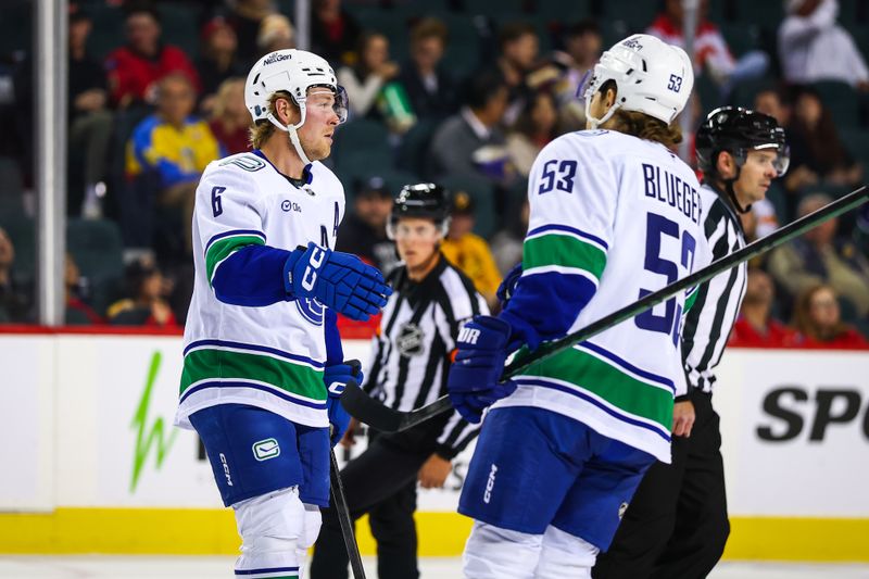 Oct 1, 2025; Calgary, Alberta, CAN; Vancouver Canucks right wing Brock Boeser (6) celebrates his goal with teammates against the Calgary Flames during the first period at Scotiabank Saddledome. Mandatory Credit: Sergei Belski-Imagn Images