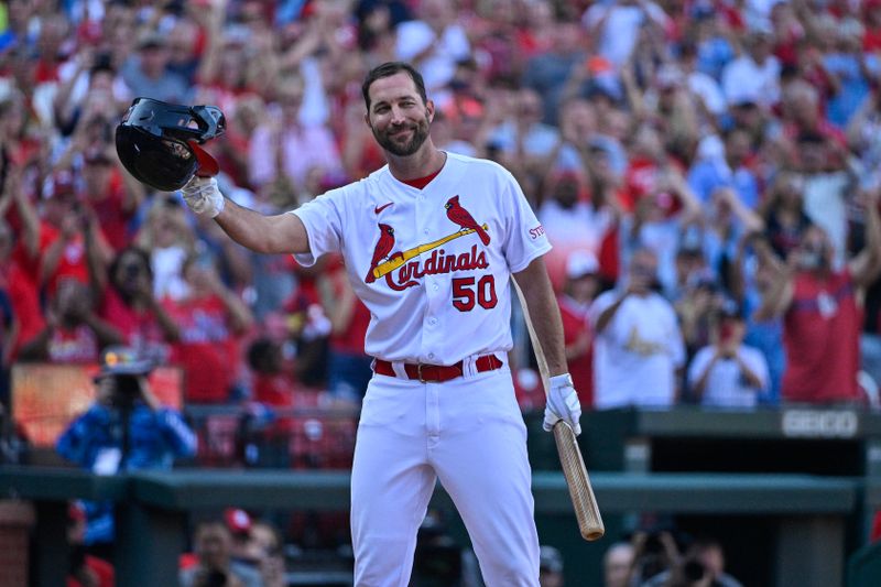 Oct 1, 2023; St. Louis, Missouri, USA;  St. Louis Cardinals pinch hitter Adam Wainwright (50) tips his cap as he receives a standing ovation before his final at bat during the eighth inning against the Cincinnati Reds at Busch Stadium. Mandatory Credit: Jeff Curry-USA TODAY Sports