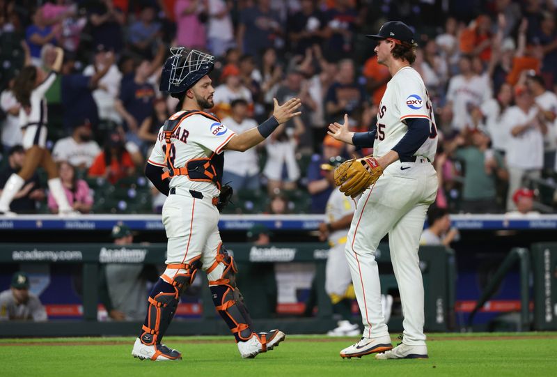 May 27, 2025; Houston, Texas, USA; Houston Astros catcher Cesar Salazar (18) celebrates with relief pitcher Forrest Whitley (55) after defeating the Athletics at Daikin Park. Mandatory Credit: Thomas Shea-Imagn Images