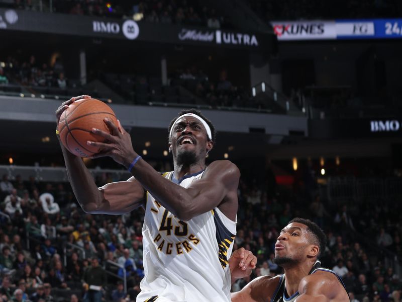 MILWAUKEE, WI - NOVEMBER 22:  Pascal Siakam #43 of the Indiana Pacers dribbles the ball during the game against the Milwaukee Bucks during a Emirates NBA Cup on November 22, 2024 at Fiserv Forum Center in Milwaukee, Wisconsin. NOTE TO USER: User expressly acknowledges and agrees that, by downloading and or using this Photograph, user is consenting to the terms and conditions of the Getty Images License Agreement. Mandatory Copyright Notice: Copyright 2024 NBAE (Photo by Gary Dineen/NBAE via Getty Images).