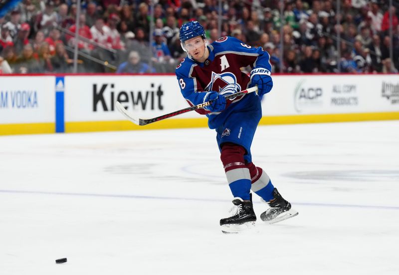 Mar 6, 2024; Denver, Colorado, USA; Colorado Avalanche defenseman Cale Makar (8) passes the puck in the second period against the Detroit Red Wings at Ball Arena. Mandatory Credit: Ron Chenoy-USA TODAY Sports