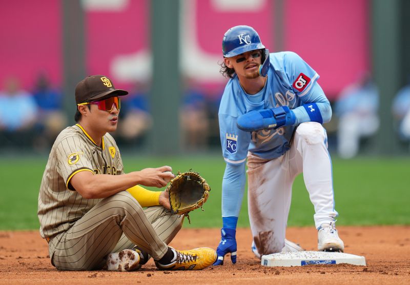 Jun 1, 2024; Kansas City, Missouri, USA; Kansas City Royals shortstop Bobby Witt Jr. (7) reacts after stealing second base against San Diego Padres shortstop Ha-Seong Kim (7) during the first inning at Kauffman Stadium. Mandatory Credit: Jay Biggerstaff-USA TODAY Sports