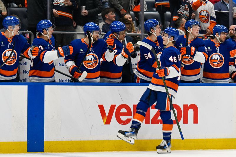 Nov 28, 2025; Elmont, New York, USA; New York Islanders defenseman Matthew Schaefer (48) celebrates his goal against the Philadelphia Flyers during the second period at UBS Arena. Mandatory Credit: Dennis Schneidler-Imagn Images
