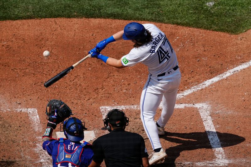 Jul 28, 2024; Toronto, Ontario, CAN; Toronto Blue Jays right fielder Addison Barger (47) makes contact with a ball against the Texas Rangers during the sixth inning at Rogers Centre. Mandatory Credit: John E. Sokolowski-USA TODAY Sports