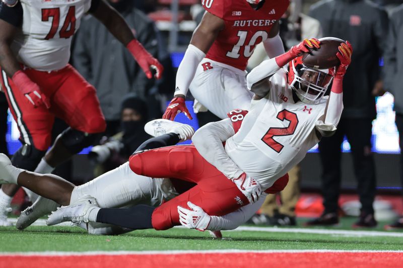 Nov 25, 2023; Piscataway, New Jersey, USA; Maryland Terrapins tight end Corey Dyches (2) is tackled short of the goal line by Rutgers Scarlet Knights linebacker Dariel Djabome (28) during the second half at SHI Stadium. Mandatory Credit: Vincent Carchietta-USA TODAY Sports