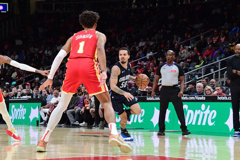 ATLANTA, GA - FEBRUARY 25: Cole Anthony #50 of the Orlando Magic dribbles the ball during the game against the Atlanta Hawks on February 25, 2024 at State Farm Arena in Atlanta, Georgia.  NOTE TO USER: User expressly acknowledges and agrees that, by downloading and/or using this Photograph, user is consenting to the terms and conditions of the Getty Images License Agreement. Mandatory Copyright Notice: Copyright 2024 NBAE (Photo by Scott Cunningham/NBAE via Getty Images)