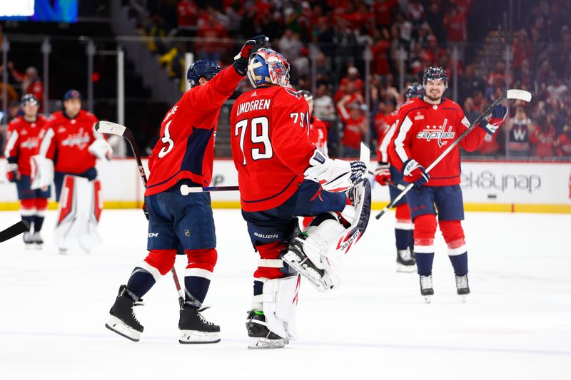 Mar 26, 2024; Washington, District of Columbia, USA; Washington Capitals goaltender Charlie Lindgren (79) celebrates after defeating the Detroit Red Wings in overtime at Capital One Arena. Mandatory Credit: Amber Searls-USA TODAY Sports