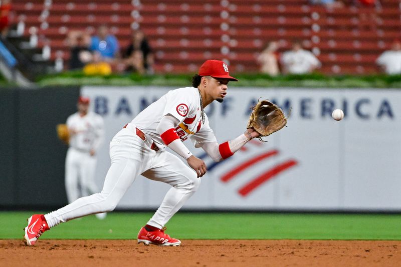 Sep 16, 2024; St. Louis, Missouri, USA;  St. Louis Cardinals shortstop Masyn Winn (0) fields a ground ball against the Pittsburgh Pirates during the eighth inning at Busch Stadium. Mandatory Credit: Jeff Curry-Imagn Images