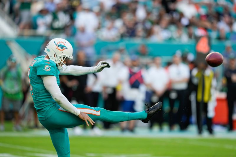 Miami Dolphins punter Thomas Morstead (4) punts the ball during the second half of an NFL football game against the New York Jets, Sunday, Jan. 8, 2023, in Miami Gardens, Fla. (AP Photo/Rebecca Blackwell)