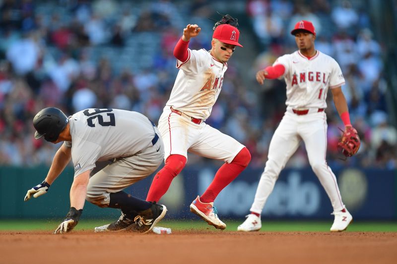 May 28, 2024; Anaheim, California, USA; New York Yankees third baseman DJ LeMahieu (26) reaches second against Los Angeles Angels shortstop Zach Neto (9) during the fourth inning at Angel Stadium. Mandatory Credit: Gary A. Vasquez-USA TODAY Sports