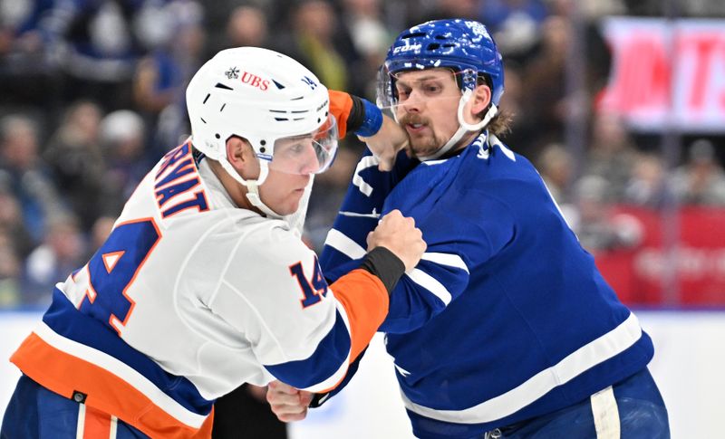 Feb 5, 2024; Toronto, Ontario, CAN;   New York Islanders forward Bo Horvat (14) fights with Toronto Maple Leafs defenseman Simon Benoit (2) in the second period at Scotiabank Arena. Mandatory Credit: Dan Hamilton-USA TODAY Sports