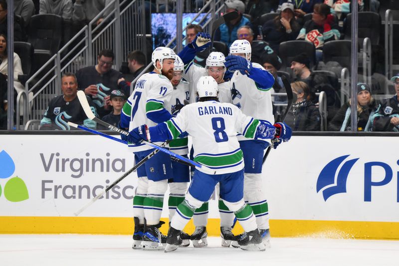 Nov 24, 2023; Seattle, Washington, USA; The Vancouver Canucks celebrate after left wing Nils Hoglander (21) scored a goal against the Seattle Kraken during the third period at Climate Pledge Arena. Mandatory Credit: Steven Bisig-USA TODAY Sports