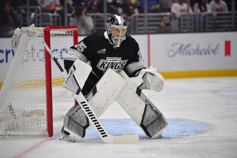 Mar 19, 2026; Los Angeles, California, USA; Los Angeles Kings goaltender Darcy Kuemper (35) defends the goal against the Philadelphia Flyers during the first period at Crypto.com Arena. Mandatory Credit: Gary A. Vasquez-Imagn Images