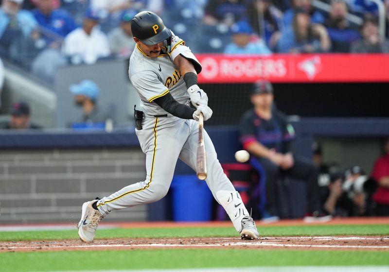 May 31, 2024; Toronto, Ontario, CAN; Pittsburgh Pirates second baseman Nick Gonzales (39) hits a single against the Toronto Blue Jays during the fifth inning at Rogers Centre. Mandatory Credit: Nick Turchiaro-USA TODAY Sports