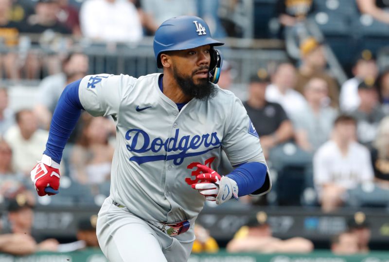 Jun 6, 2024; Pittsburgh, Pennsylvania, USA;  Los Angeles Dodgers right fielder Teoscar Hernández (37) hits a double against the Pittsburgh Pirates during the first inning at PNC Park. Mandatory Credit: Charles LeClaire-USA TODAY Sports