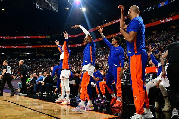 PHOENIX, AZ - DECEMBER 15: The New York Knicks bench celebrates a three point basket during the game against the Phoenix Suns on December 15, 2023 at Footprint Center in Phoenix, Arizona. NOTE TO USER: User expressly acknowledges and agrees that, by downloading and or using this photograph, user is consenting to the terms and conditions of the Getty Images License Agreement. Mandatory Copyright Notice: Copyright 2023 NBAE (Photo by Kate Frese/NBAE via Getty Images)