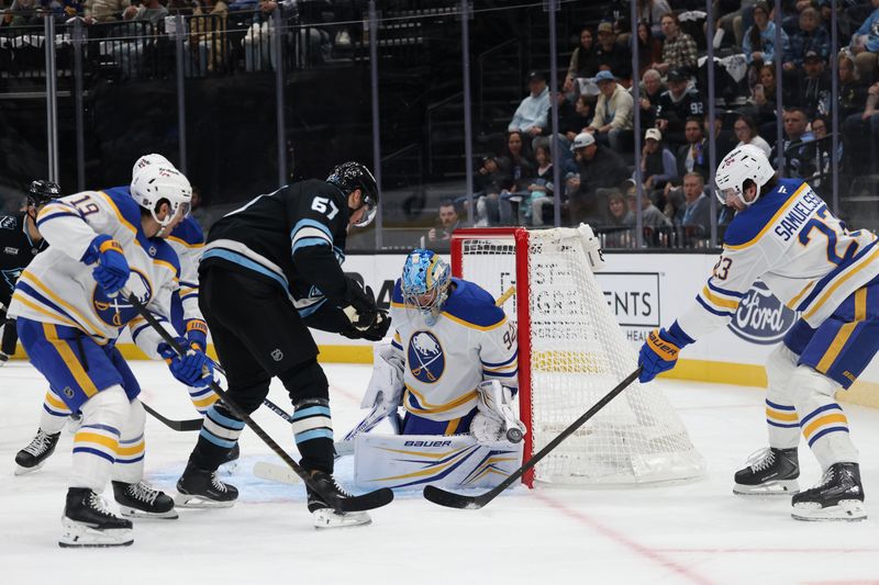 Nov 12, 2025; Salt Lake City, Utah, USA; Buffalo Sabres goaltender Colten Ellis (92) blocks a shot by Utah Mammoth left wing Lawson Crouse (67) during the first period at Delta Center. Mandatory Credit: Rob Gray-Imagn Images