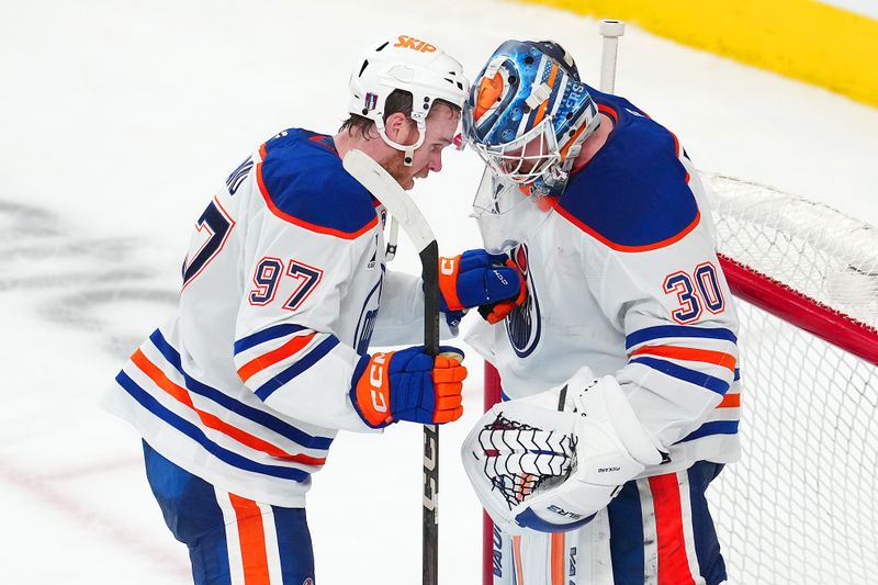 May 6, 2025; Las Vegas, Nevada, USA; Edmonton Oilers center Connor McDavid (97) congratulates goaltender Calvin Pickard (30) after defeating the Vegas Golden Knights 4-2 in game one of the second round of the 2025 Stanley Cup Playoffs at T-Mobile Arena. Mandatory Credit: Stephen R. Sylvanie-Imagn Images